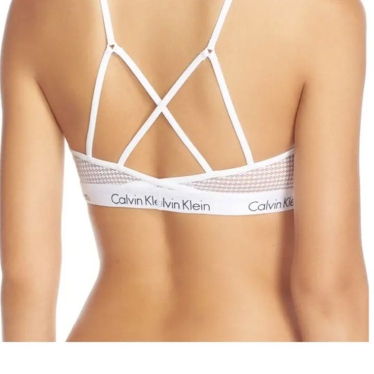 Calvin Klein Ck One Micro Bralette This Sporty Take On The Lightly Supportive Bralette Is Made From Airy Mesh And Backed By A Web Of Straps. Size: Large (L=36) Color: White Style # Qf1323-100 89% Nylon, 11% Elastane. Strappy Back Detail, Unlined Light Weight, Semi-Sheer New With Tags Fast Shipper Top Rated Seller Posh Ambassador Questions Welcome Non-Smoking Home Fitted Calvin Klein Bra For Summer, Calvin Klein Fitted Bra For Summer, Summer Mesh Bra, Fitted Calvin Klein Summer Bra, Summer Bra With Mesh Back, Calvin Klein Ck One, Ck One, Calvin Klein White, White Style