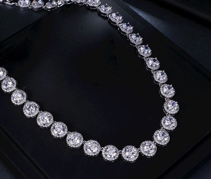 A beautiful two-piece bridal jewelry set with an incredible sparkle! Adorned with intricately faceted cubic zirconia that capture the light from every angle with a perfectly translucent appeal, the pieces are platinum plated for a flawless finish which enhances the intricate detailing and conveys a modern take on old elegance. Necklace: 16" (approx. 40.6cm) long with a secure fold-over closure (a 2" extension can be added if a longer length is needed, please leave a note with your order at check Silver Wedding Jewelry, Bridal Jewelry Set, Bridal Jewelry Collection, Bridal Bracelet, Bridal Jewelry Sets, Matching Bracelets, Exquisite Design, Jewelry Set, Bridal Jewelry