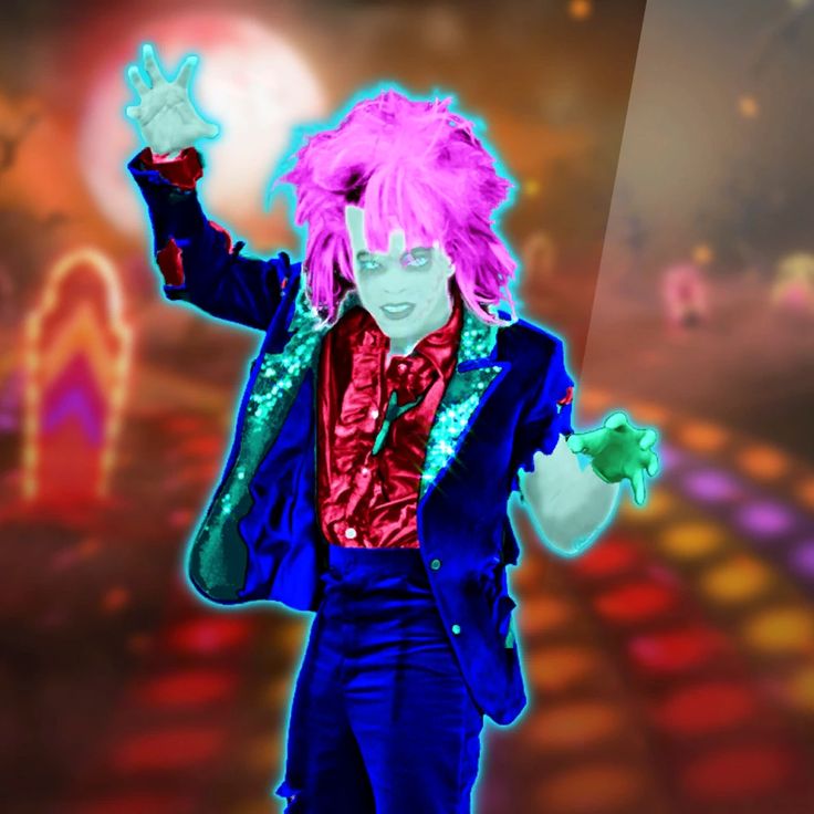 a man with pink hair and glasses is dressed in a blue suit while holding his hands up