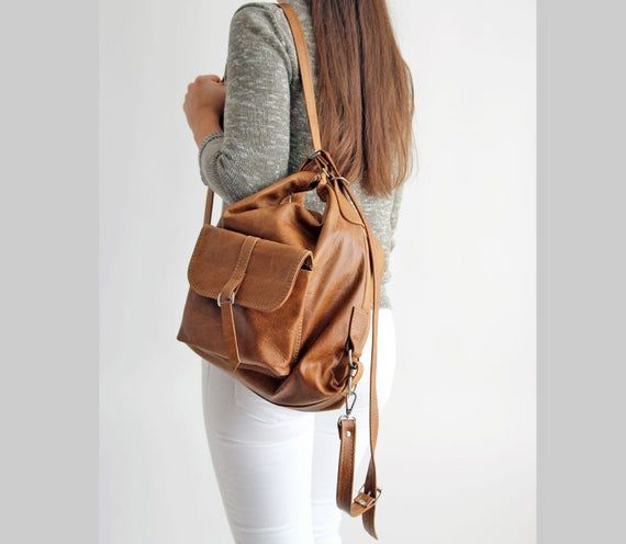 Brown Leather backpack, Woman backpack, Small backpack,  Ladies backpack, Brown Leather RucksackLeather bag, shoulder bag women package, travel backpack, women bagbackpack - bag  2in1More bags available in my shop: https://www.etsy.com/shop/BarbaraLeatherDesignThe Backpack/Handbag with backpack attachments is the perfect size to carry your daily essentials in style!The backpack is made from top quality leather. Thanks to solid nikel hardware silver and leather construction this bag is ready to b Trendy Crossbody Leather Backpack For Travel, Trendy Leather Crossbody Backpack For Travel, Casual Leather Backpack With Removable Pouch For School, Casual Leather Backpack With Adjustable Strap For Travel, Trendy Leather Satchel Backpack For Travel, Large Capacity Crossbody Backpack For Everyday Use, Casual Leather Backpack With Removable Pouch, Trendy Leather Duffle Bag For Travel, Casual Leather Duffle Bag Backpack