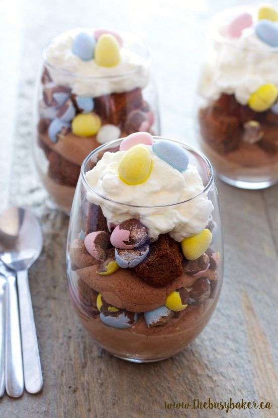 three desserts in small glass dishes on a table