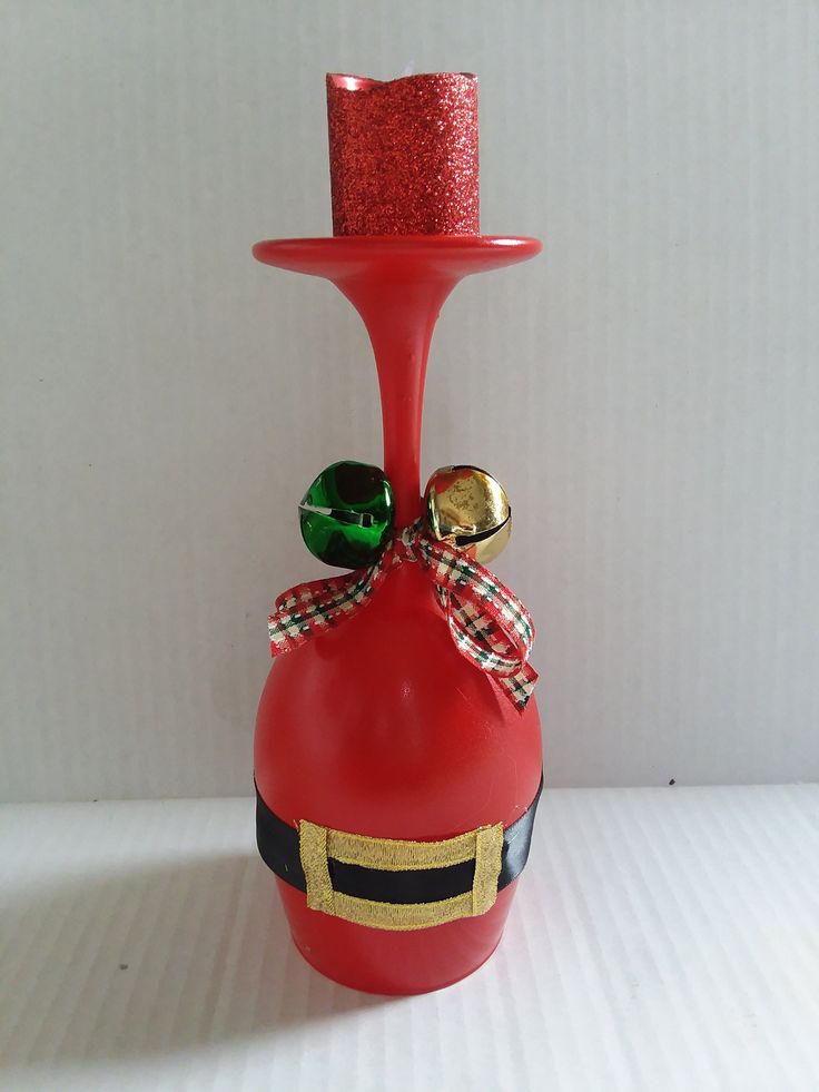 a red bottle with a top hat on it