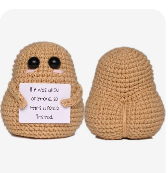 two crocheted stuffed animals one has a sign that says fire was all out of wrongs so it's a potato