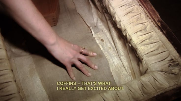 a person reaching for something on top of a box with the words coefins - that's what i really get excited about