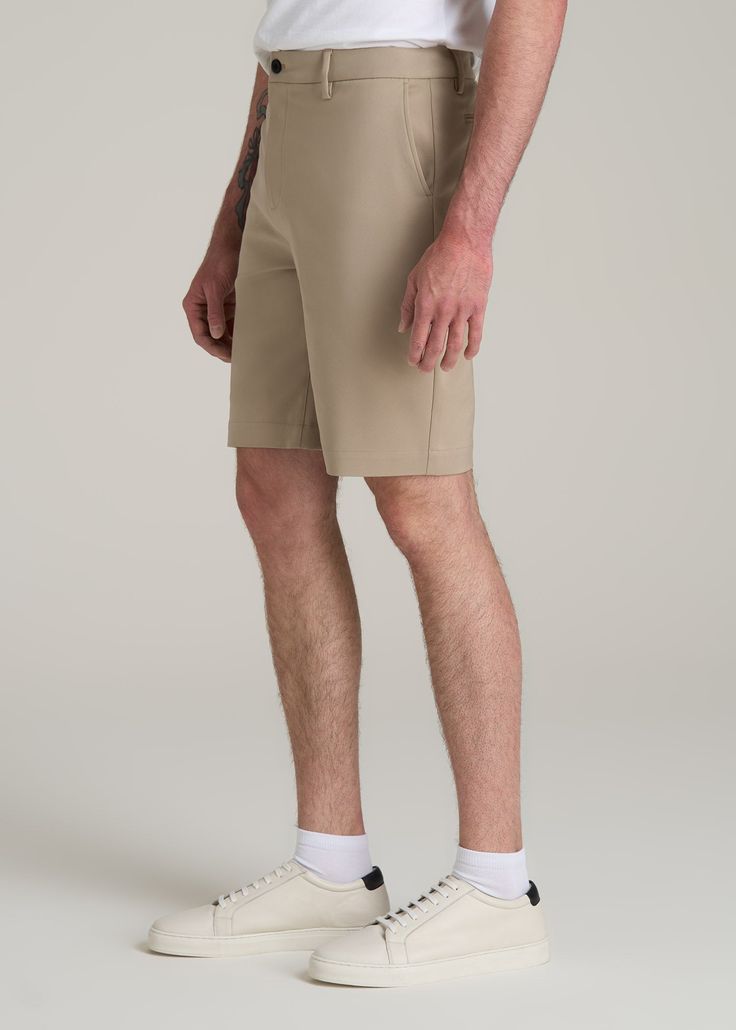 Tall Men's Shorts for the Everyday Where Function Meets Fashion Introducing our Tech Chino Shorts, a staple for the tall man's summer wardrobe. Designed with stretch fabric and a stretch waistband, these tall men's shorts offer unparalleled comfort and flexibility. The above-knee length and modern fit ensure a sleek, contemporary look, while the functional pockets add practicality. • Stretch fabric for ultimate comfort• Modern fit and above-knee length for a contemporary look• Functional pockets Classic Stretch Bottoms With Built-in Shorts, Casual Fitted Golf Shorts, Summer Comfort Stretch Bottoms With Pockets, 4-way Stretch Summer Pants With Pockets, Casual Spring Golf Bottoms, Sporty Bottoms With Straight Hem For Summer, Cotton Golf Bottoms With Built-in Shorts, Sporty Golf Bottoms For Spring, Sporty Summer Bottoms With Straight Hem