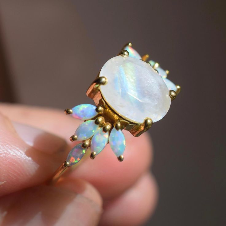 Product Description: 18kt gold vermeil 8x6mm oval faceted rainbow moonstone 4x2mm marquise cut opals Vermeil Jewelry, Rings Cool, Jewelry Cleaner, Marquise Cut, Precious Gemstones, Moon Stone, Gold Plated Jewelry, Jewelry Plate, Rainbow Moonstone