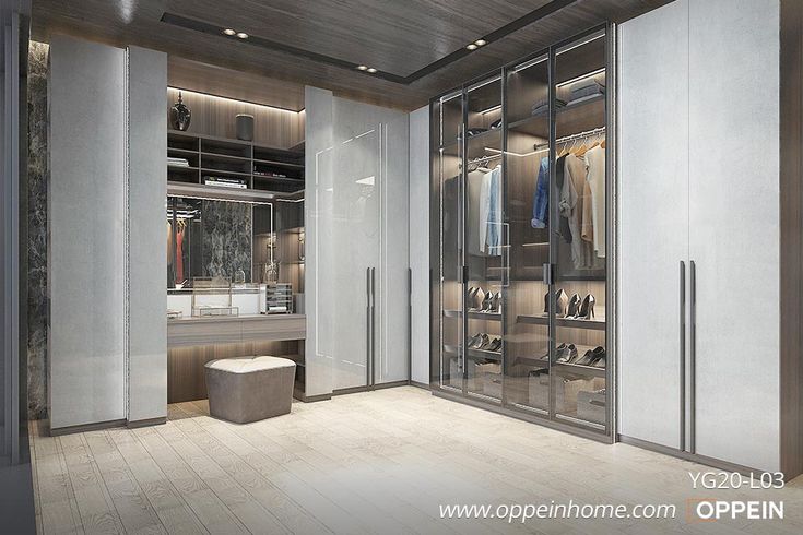 an empty walk - in closet with mirrored doors and shelves filled with clothes, shoes and other items