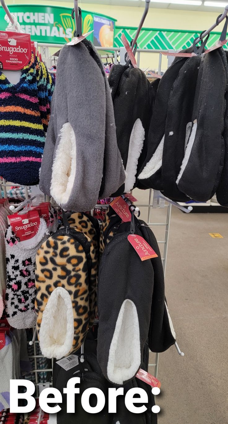 there are many hats and mittens on display at the store, but no one is wearing them