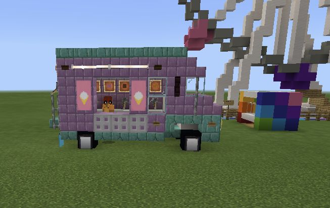 a small purple truck parked in front of a large pixely building with an animal on the roof