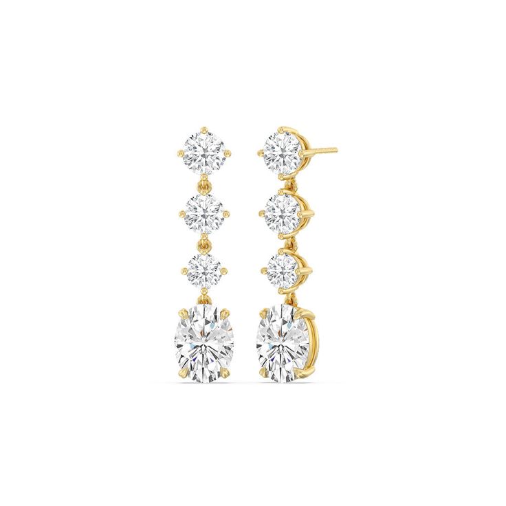 These diamond danglers exude a sense of sophistication and ease. They look relaxed and refined at once with their linear design and subtle movement. Each earring features a trio of round diamonds set in a vertical row and punctuated by a larger oval-cut diamond at the end. This elegant pair is the perfect choice when you want to dress to impress yet still be comfortable. Classic Diamond Drop Earrings For Everyday Luxury, Classic Gold Linear Earrings With Brilliant Cut, Elegant Oval Diamond Earrings, Elegant Oval Brilliant Cut Diamond Earrings, Classic Yellow Gold Linear Earrings With Prong Setting, Classic Linear Earrings With Diamond Accents In Diamond White, Classic Diamond Accents Linear Drop Earrings, Elegant Diamond Earrings With Timeless Design, Classic Yellow Gold Round Linear Earrings