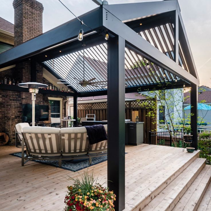 an outdoor living area with decking and patio furniture