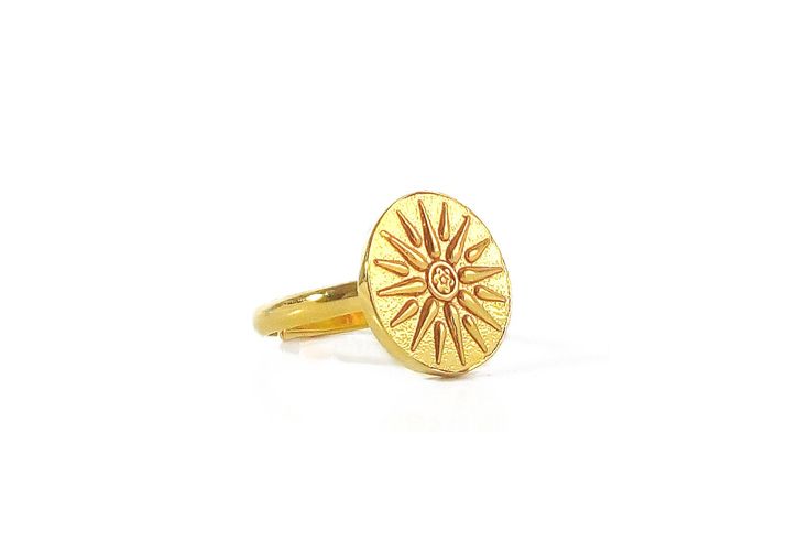 "Greek Vergina Sun Ring in 24K Gold Vermeil by Ilios This unique ring is handmade in Greece and features a pendant representing the Vergina Sun. It is a distinct solar symbol appearing in ancient Greek art from the period between the 6th and 2nd centuries BC. The Vergina Sun has sixteen triangular rays. The ring is made of 24K Gold Vermeil. The dimensions of the sun pendant is 5/8\" = 15mm. Each size adjusts up to one size. Select from three sizes: 6-7 or 7-8 or 8-9 Gold vermeil is .925 sterling Handmade Gold-plated Ring Gift, Handmade Rings In Recycled Gold For Gifts, Handmade Gold Plated Rings As Gift, Symbolic Gold Rings As Gift, Symbolic Gold Rings For Gift, Handmade Symbolic Yellow Gold Rings, Gold Sun Design Jewelry As A Gift, Handmade Celestial Rings For Gift, Symbolic Gold Plated Rings For Gifts