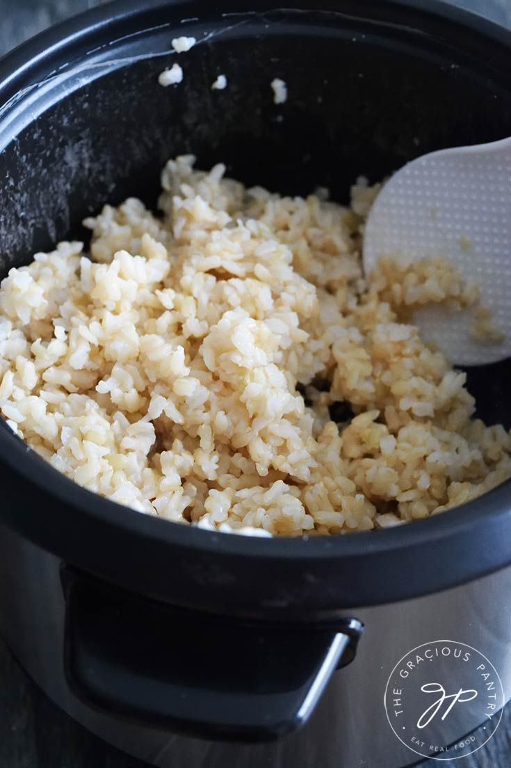 rice being cooked in an electric pressure cooker