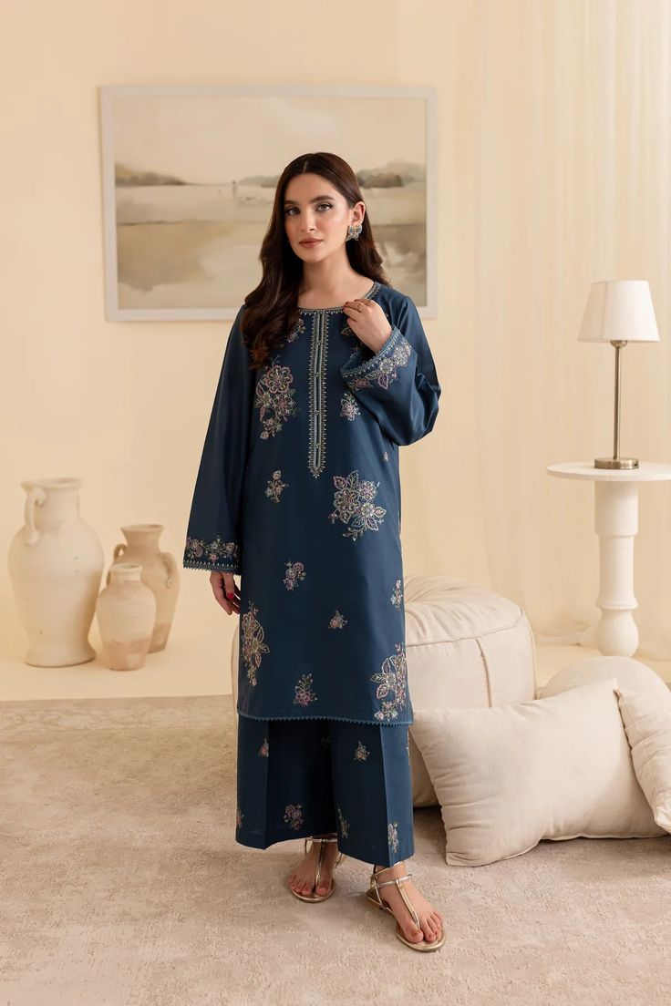 Batik Embroidered Lawn Dress Adira 2Pc Embrace tradition with our Pakistani outfits online. This ready-to-wear 2Pc dress in premium Pima lawn features a straight fit shirt with an embroidered neckline and composed motifs. The loose fit sleeves are adorned with embroidered borders and lace. Paired with embroidered cambric culottes, it captures the essence of celebration. Premium Pima lawn Embroidered neckline Straight fit shirt Embroidered cambric culottes Note: Colors may slightly vary due to li Blue Embroidered Summer Sets, Spring Designer Blue Dress, Unstitched Blue Sets With Floral Embroidery, Blue Summer Lawn Suit With Chikankari Embroidery, Summer Blue Lawn Suit With Chikankari Embroidery, Blue Traditional Wear With Intricate Embroidery For Spring, Spring Blue Traditional Wear With Intricate Embroidery, Blue Semi-stitched Lawn Suit With Floral Embroidery, Blue Salwar Kameez With Intricate Embroidery For Spring