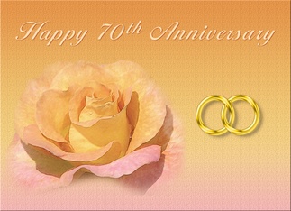 an anniversary card with two wedding rings and a rose