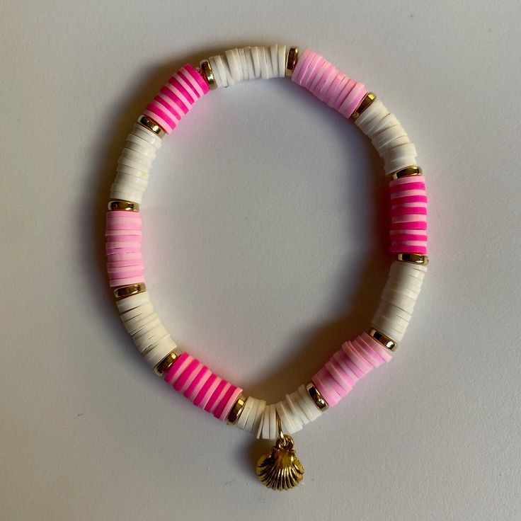 Pink & white clay bead seashell bracelet White Shell Bracelet For Vacation, White Shell-shaped Beaded Bracelets For Vacation, White Shell-shaped Bracelet As A Gift, White Shell-shaped Bracelet For Gift, Handmade White Shell-shaped Bracelets, White Pearl Bracelet With Colorful Beads For Beach, Casual White Shell As A Gift, Handmade White Pearl Bracelet For Vacation, White Beaded Shell-shaped Bracelets