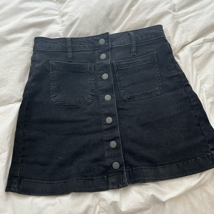 Great Condition. Never Worn. Black Denim Short Skort, Black Fitted Denim Skort, Fitted Denim Black Skort, Black Denim Short Length Skort, Fitted Black Denim Skort, Black Mid-rise Skirt With Pockets, Mid-rise Black Skirt With Pockets, Black High Rise Fitted Skort, Casual High Rise Black Skort