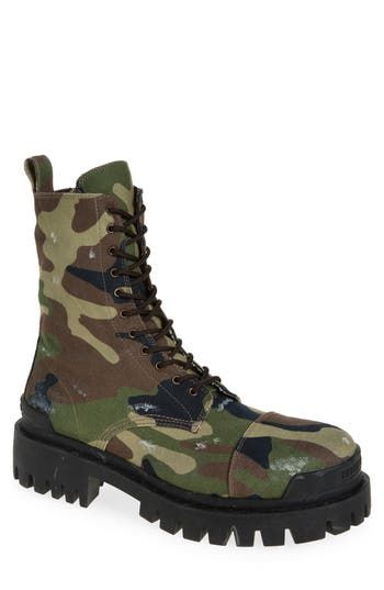 A superchunky lug sole amplifies the robust attitude of this lace-up combat boot fashioned from camo-print cotton canvas that bears its share of battle scars. Lace-up style Textile upper and lining/rubber sole Made in Italy Designer Shoes Fall Combat Boots With Vibram Sole For Streetwear, Rugged Lace-up Combat Boots For Streetwear, Fall Streetwear Steel Toe Combat Boots, Fall Streetwear Combat Boots With Steel Toe, Rugged Combat Boots With Reinforced Toe For Streetwear, Grunge Combat Boots With Lug Sole For Fall, Rugged Streetwear Combat Boots With Steel Toe, Rugged Combat Boots With Steel Toe For Streetwear, Rugged Steel Toe Combat Boots For Streetwear