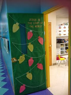 a classroom door decorated with paper hearts and the words jesus is the light of the world