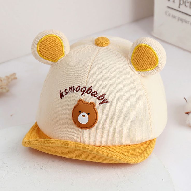 Adorable and Practical Sun Protection for Your Little One Let your baby enjoy sunny adventures with this irresistibly cute baby hat featuring adorable bear ears. Designed with both boys and girls in mind, this baseball-style cap will keep your little one shaded and stylish throughout summer and autumn. Made from a comfortable blend of cotton and polyester, this hat is soft on delicate skin and lightweight for all-day wear. An adjustable strap ensures a snug fit for infants aged 6 to 36 months, so your growing child can stay protected while playing outside. Key Features Material: High-quality cotton and polyester blend for breathability and comfort. Size: Adjustable 46-50cm(18.1in-19.7in) to fit infants 6-36 months. Adjustable Strap: Secure fit that grows with your baby. Cartoon Bear Ears: Cute Cotton Hat For Outdoor, Cute Cotton Outdoor Hat, Cute Cap Style Sun Hat For Playtime, Cute Baseball Cap For Outdoor, Cute Outdoor Baseball Cap, Cute White Bucket Hat For Outdoor, Cute Outdoor Baseball Cap - One Size Fits Most, Cute Outdoor Baseball Cap, One Size Fits Most, Cute One Size Fits Most Baseball Cap For Outdoors