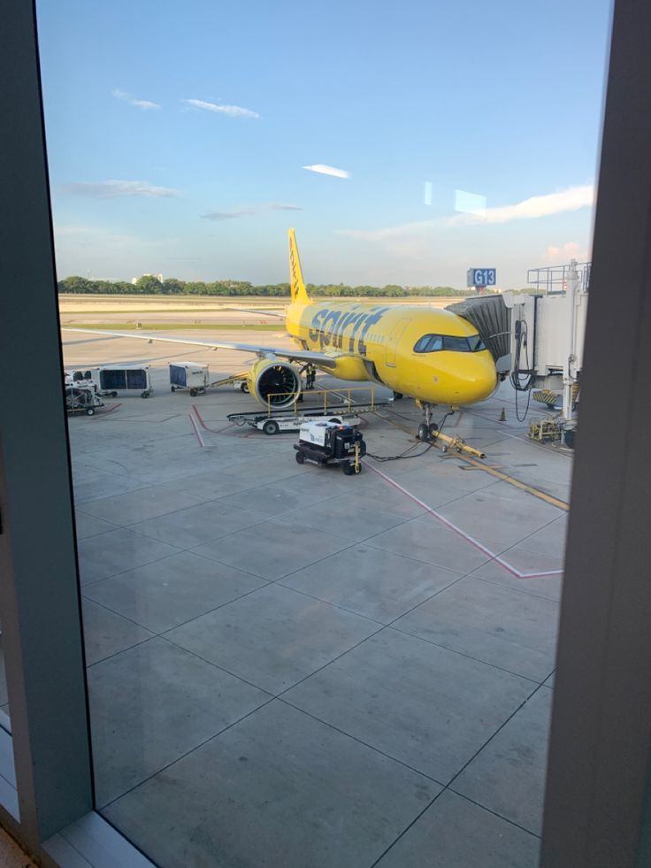 an airplane sitting on the tarmac at an airport