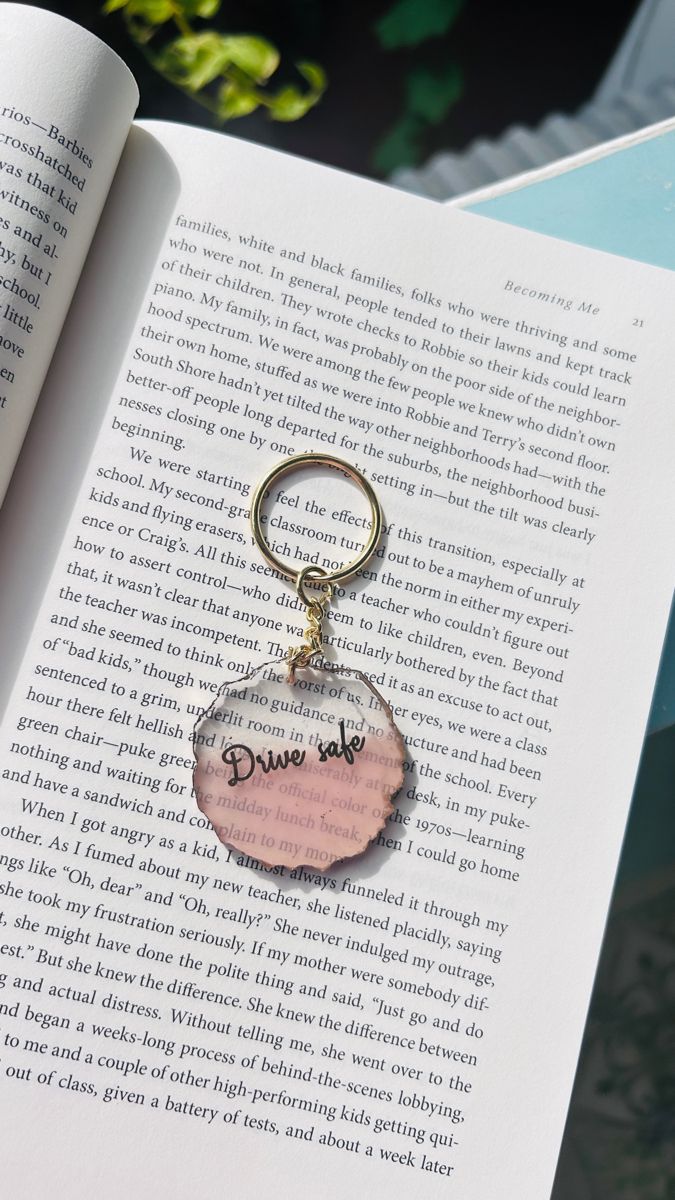 an open book with a keychain that says, don't touch me