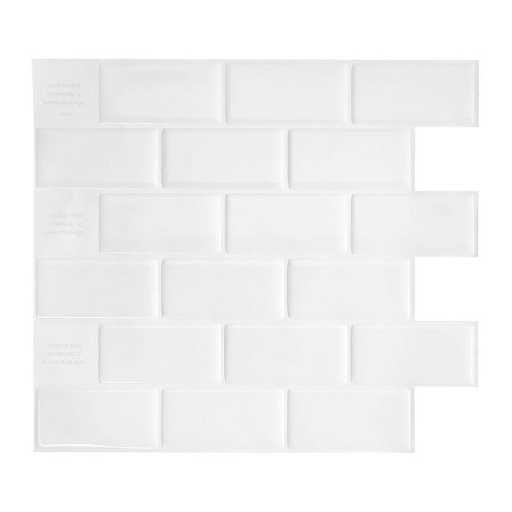 a white tile wall with several squares on it