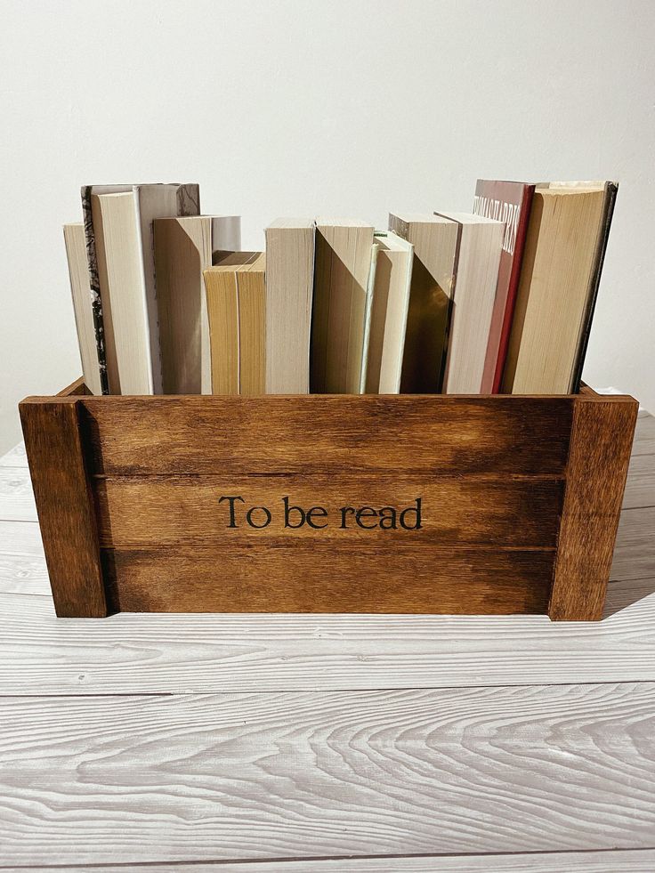 a wooden box filled with lots of books