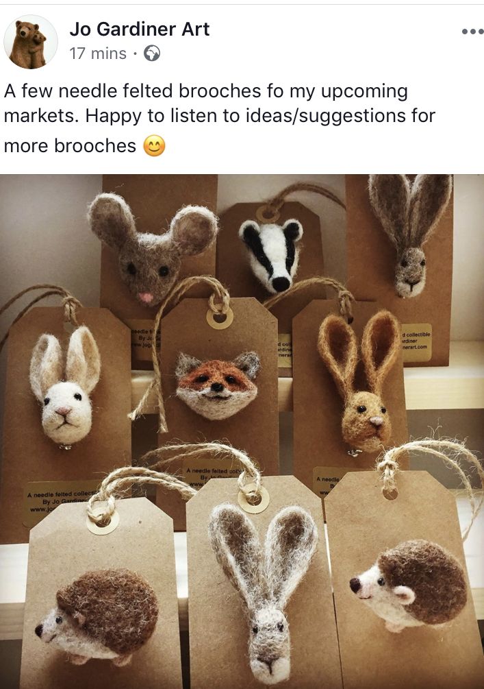 several small animal heads on brown paper bags with tags attached to them, and two smaller animals in the background