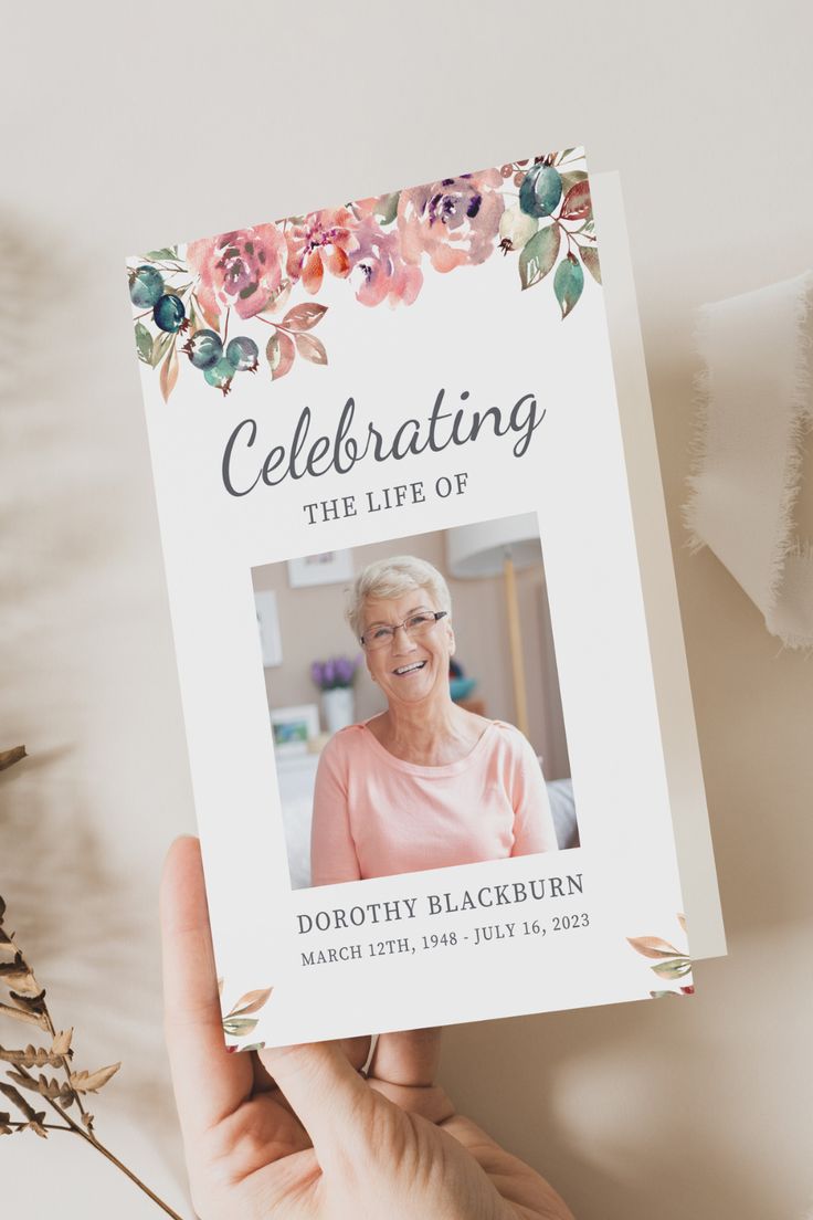 a woman holding up a card with the words celebrating the life of betty blackburn