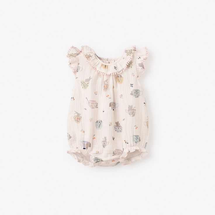 Good for baby, good for environment. Our organic, naturally sustainable muslin is soft and breathable, ideal for outdoor adventures during the warmer months. Created in a whimsical tea party print, this muslin bubble romper looks adorable and wears beautifully. 100% organic cotton muslin, GOTS certified Snaps for easy changing Coconut button closure on the back Machine wash normal, Do not bleach, Tumble dry normal, Iron medium, Do not dryclean Cute Spring Onesie For Bedtime, Cute Printed Bubble Romper For Playwear, Playful Printed Bubble Romper For Playtime, Playful Printed Cotton Bubble Romper, Cute Printed Bubble Romper, Playful White Printed Bubble Romper, Pink Cotton Printed Onesie, Pink Printed Cotton Onesie, Sweet Cotton Onesie For Summer