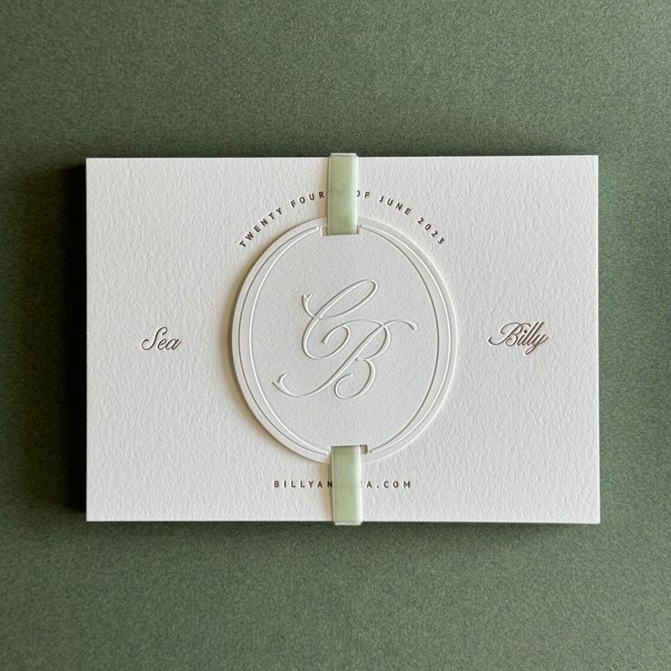 a white business card with a monogrammed letter b on the front and bottom