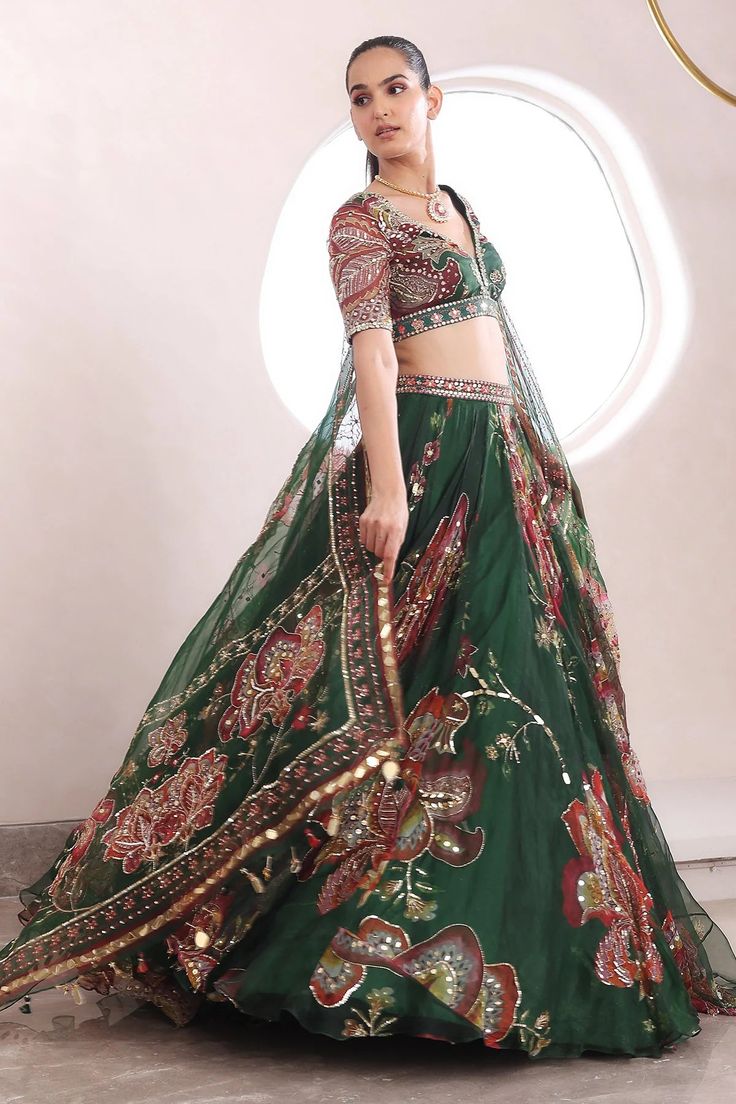 Embroidered Blouse With Heavily Embroidered Lehenga And DupattaFrom Mahima Mahajan's Fida collection. DELIVERY TIMEPlease allow 6-8 weeks for your outfit to arrive. FABRIC DETAILSOrganza Professional cleaning only. Transitional Green Floral Embroidered Sets, Transitional Season Festive Lehenga With Floral Embroidery, Transitional Festive Lehenga With Floral Embroidery, Green Traditional Wear With Floral Embroidery For Reception, Kritika Khurana Indian Outfits, Green Lehenga With Floral Embroidery For Navratri, Bollywood Style Green Choli With Floral Embroidery, Festival Green Choli With Floral Embroidery, Green Floral Embroidered Fabric For Reception