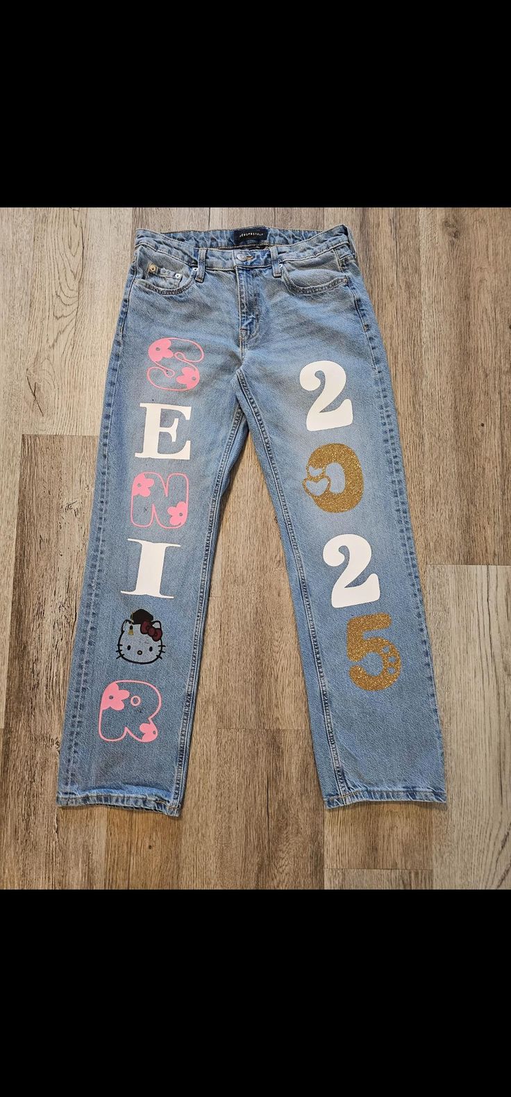 Senior Jeans made to order Any design can be done Please send an inspo pic and we will recreate it for you Follow us on Instagram @ caroboutiquegoods White Senior Pants, Senior Spirit Jeans, Spirit Jeans Ideas, Senior Pants Ideas, Homecoming Pants, Senior Painted Jeans, Senior Pants, Senior Year Things, Senior Jeans