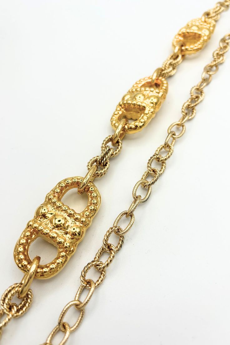 Transform your outfit into a fashion masterpiece with the Areti Ornate Golden Etched Chain Belt. Its intricate design and golden finish will add a touch of glamour and sophistication to any look. Elevate your style game with this unique accessory. Details:- Mixed Etched Cable Chain- Vintage Elements- Adjustable to Desired Length- Handmade at JFY Dimensions:- 44" Total Length Luxury Metal Jewelry With Gold-tone Hardware, Gold Chain Link Jewelry With Gold-tone Hardware, Formal Yellow Gold Chain Necklace With Gold Clasp, Luxury Gold-tone Metal Chain Belt, Gold Metal Jewelry With Gold-tone Hardware, Luxury Gold-tone Chain Necklace For Party, Luxury Metal Chain Belt For Formal Occasions, Luxury Gold Metal Chain Belt, Luxury Gold Chain Necklace For Party