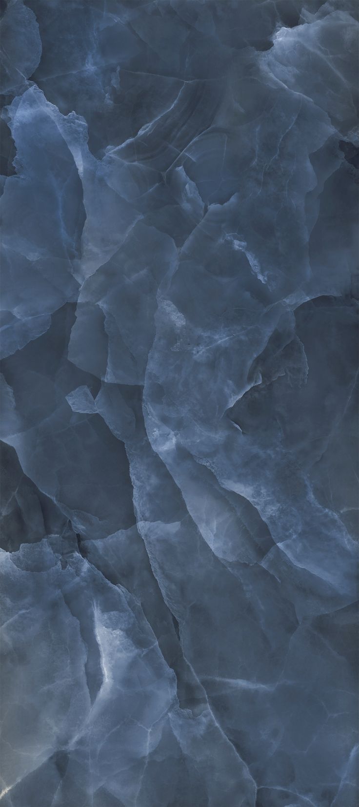 an abstract photo of ice on the ground with blue and gray colors, as seen from above