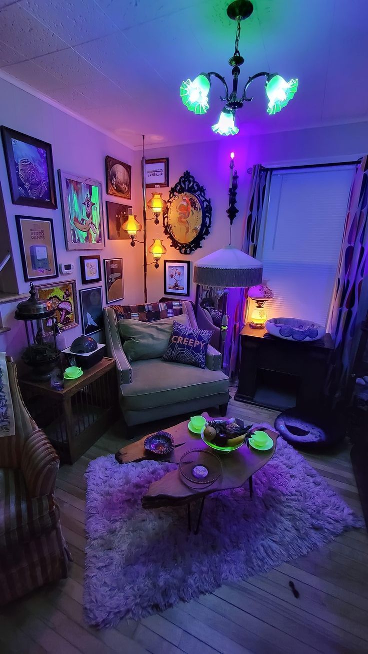 a living room filled with furniture and pictures on the wall next to a purple light