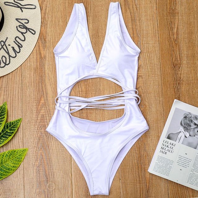 Wrap Around One Piece Cut Out Swimsuit Sunset and Swim White S Cutout One-piece Bodysuit For Beachwear, Backless Bodysuit For Beach Party Season, Backless Beachwear One Piece For Beach Season, Backless Bodysuit For Sunbathing And Beach Season, Beachwear One-piece Bodysuit For Vacation, Backless Beachwear Bodysuit For Vacation, One-piece Pool Bodysuit For Vacation, Summer Backless Beach Bodysuit, One-piece Bodysuit For Sunbathing On Vacation