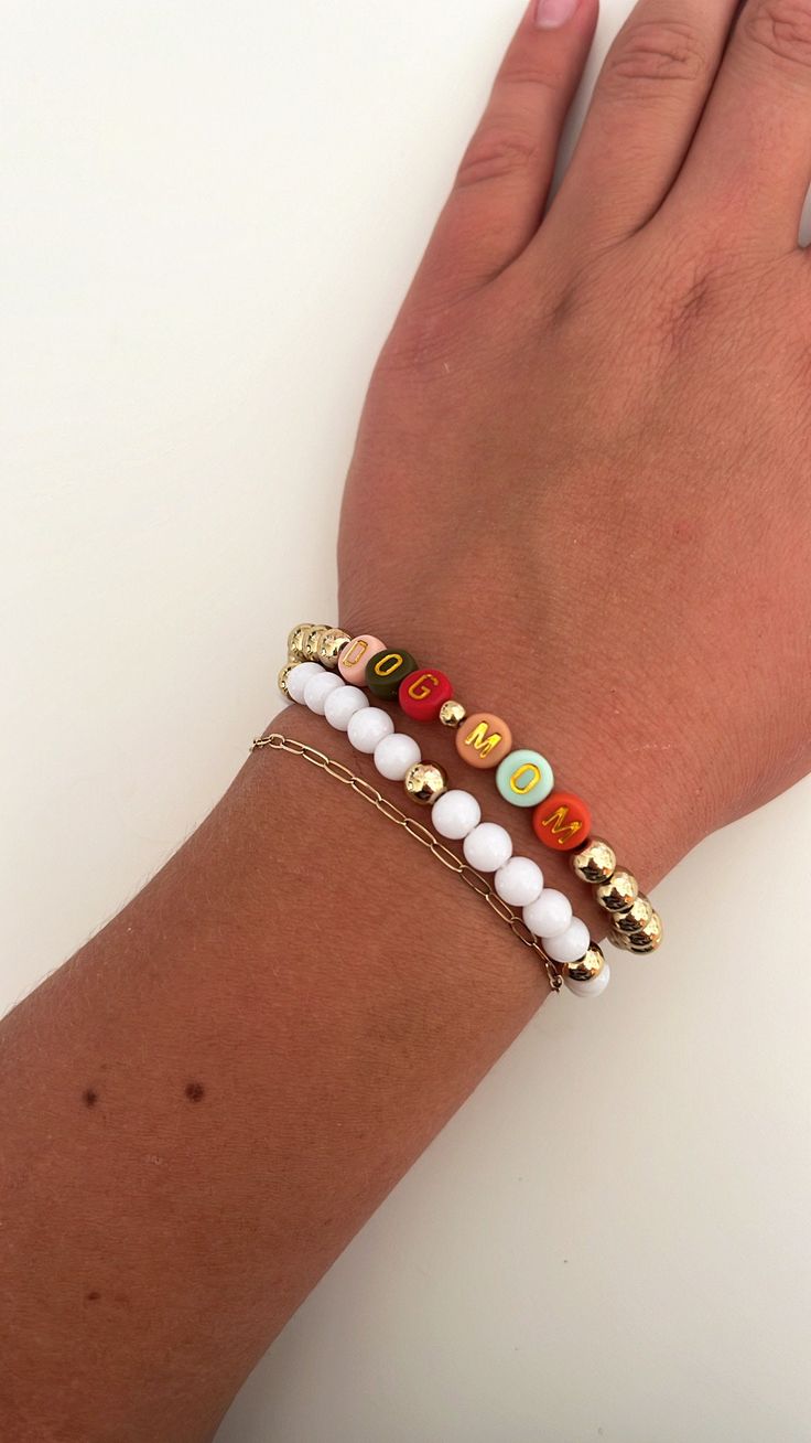 This is a super cute Dog Mom bracelet stack!! This set includes 2 bracelets. These bracelets are super strong and have been double wrapped and glued to ensure they won't break. These work perfectly for gifts and for all occasions! Disclaimer: the dainty gold chain is not included Dog Mom Bracelet Stack, Trendy Stackable Jewelry For Friendship, Trendy Stackable Wrap Bracelet With Round Beads, Trendy Letter Beads Jewelry For Friendship, Adjustable Stacked Bracelets As Gift, Trendy Stackable Charm Bracelet Gift, White Stacked Stretch Bracelet As Gift, White Stacked Stretch Bracelet Gift, Trendy White Charm Bracelet With Letter Beads