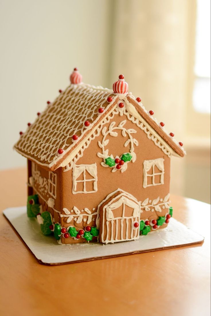 a gingerbread house is sitting on a table