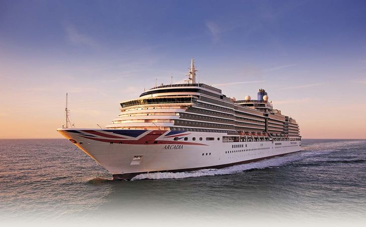 a large cruise ship in the middle of the ocean at sunset or sunrise with blue sky and clouds