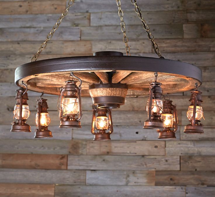 a chandelier hanging from the ceiling with many lights on it and wood accents