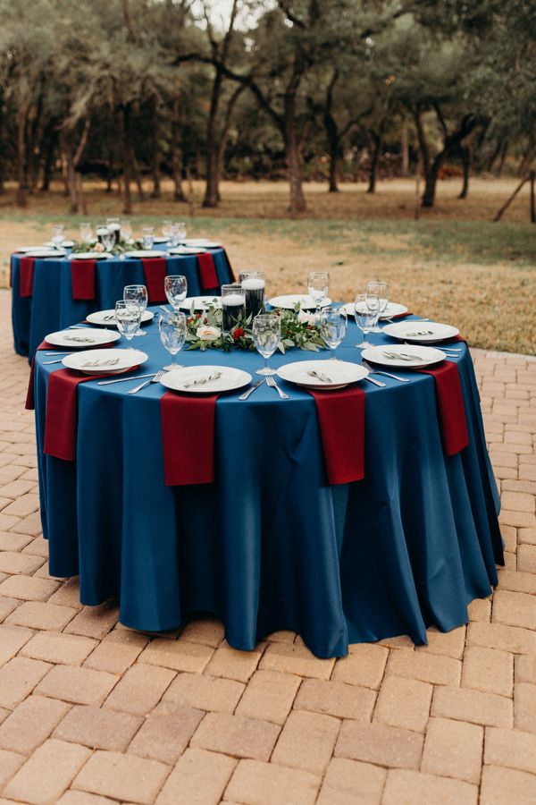 the table is set with plates and glasses