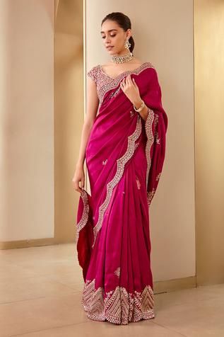 Plum saree with scallop embroidered border. Paired with floral, sequin embroidered blouse.
Component: 2
Pattern: Embroidery
Type Of Work: Scallop, floral, sequin
Neckline: Leaf
Sleeve Type: Cap sleeves
Fabric: Mulberry silk
Color: Purple
Other Details: 
Scallop border
Back deep V neck blouse
Occasion: Reception - Aza Fashions Cutwork Saree, Simple Saree Designs, Saree Bollywood, Purple Saree, Fancy Sarees Party Wear, Simple Sarees, Saree Designs Party Wear, Patiala Salwar, Take A Screenshot