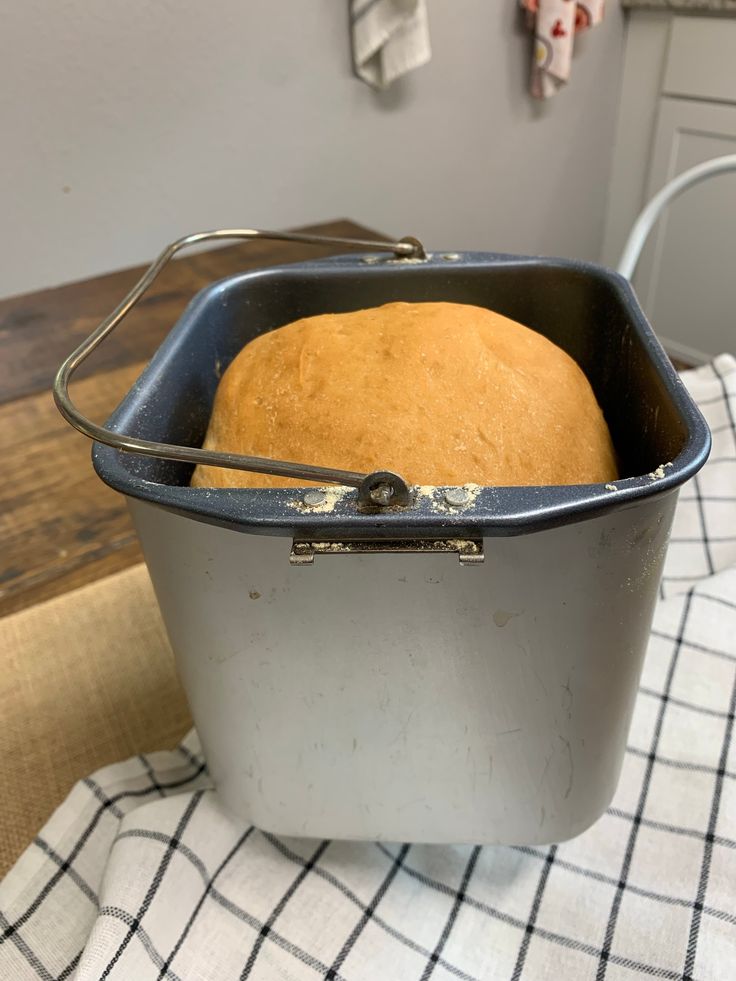 a loaf of bread sitting in a pan on top of a table