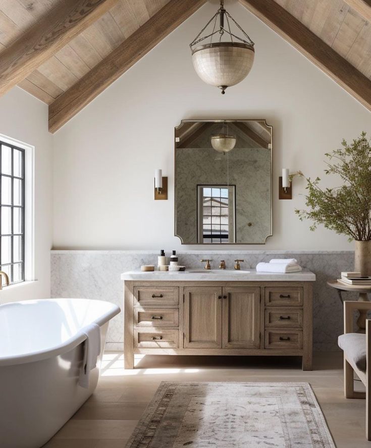 a bath room with a tub a sink and a mirror on the wall next to a window