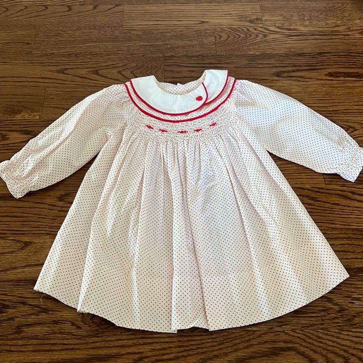 This Is Precious And In Brand New Never Worn Condition. Peter Pan Collar. Button Back Closure. Cute Long Sleeve Fitted Smocked Dress, Cute Red Smock Dress, Cute Long Sleeve Smocked Dress With Smocked Cuffs, Sweet Red Long Sleeve Dress, White Smocked Dress, Christmas Clothes, Dresses Red, Smocked Dress, Pan Collar