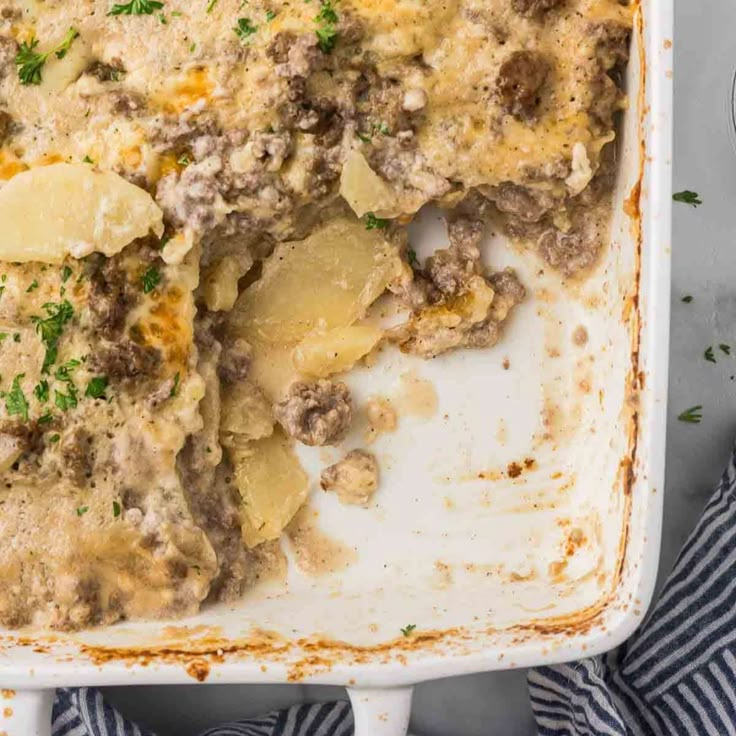 a casserole dish filled with meat and potatoes