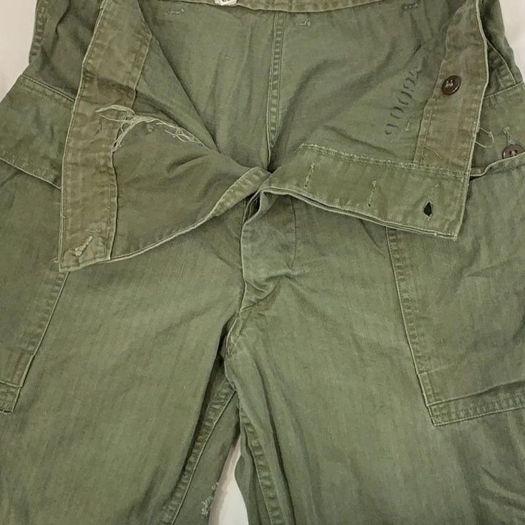 Vintage military work wear pants 1930-60s Size: W 34" L 33" Military Style Wide Leg Work Pants With Pockets, Military Style Khaki Straight Leg Jeans, Military Wide Leg Work Pants With Pockets, Full Length Military Cotton Bottoms, Military Style Wide Leg Pants With Belt Loops, Military Wide Leg Cargo Pants, Military Style Workwear Pants, Military Style Cargo Jeans For Work, Vintage Cargo Pants With Pockets For Work