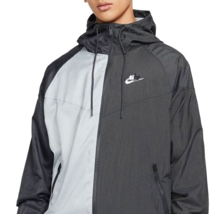 The Nike Sportswear Sport Essentials+ Windrunner Jacket Fuses 2 Unique Fabrics To Create A Fashion Fusion. Fall Sports Windbreaker With Moisture-wicking, Sporty Hooded Track Jacket With Reflective Details, White Moisture-wicking Track Jacket For Gym, Sportswear Track Jacket With Reflective Details For Outdoor Activities, Hooded Track Jacket With Reflective Details For Sports, Urban Style Sports Windbreaker With Reflective Details, Outdoor Sportswear Track Jacket With Reflective Details, Sporty Hooded Windbreaker With Reflective Details, Sporty Windbreaker With Reflective Details For Sports